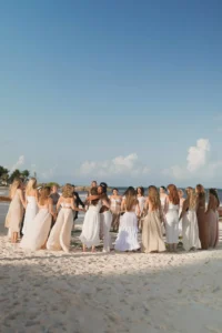 Costa Rica retreat group circle on beach feminine energy coach mel wells